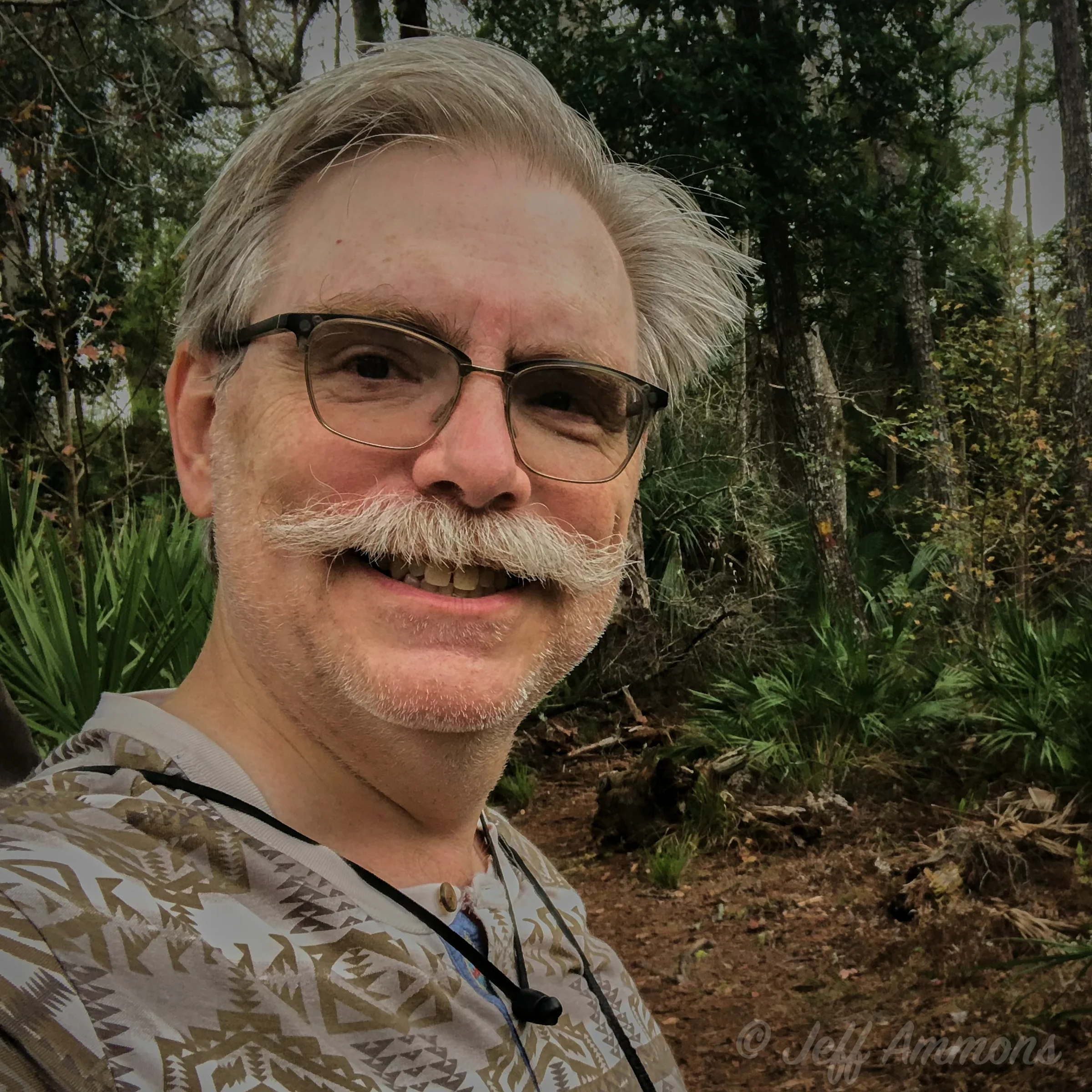 Jeff Ammons, founder of Schedule Tranquility, smiling outdoors.